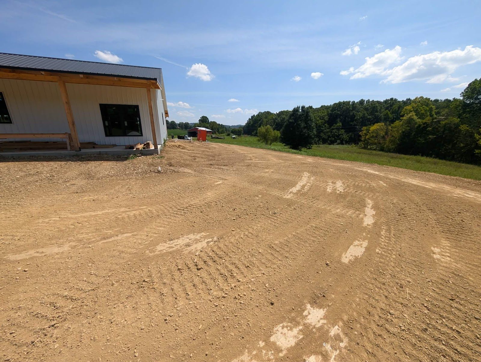 Freshly graded yard beside a new home